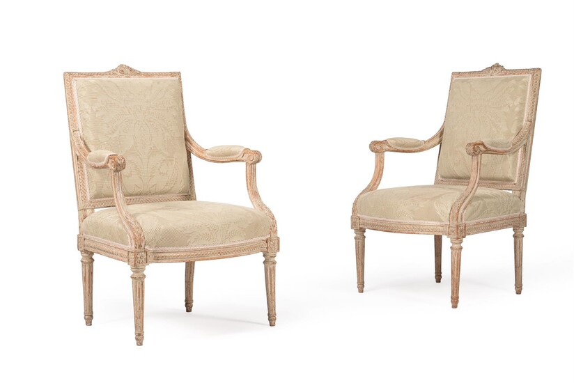 A PAIR OF LOUIS XVI CARVED BEECH AND CREAM PAINTED FAUTEUILS, LATE 18TH CENTURY