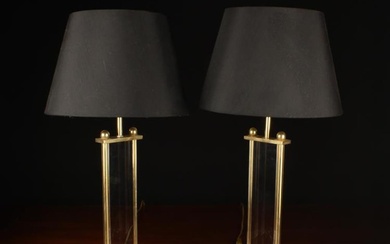 A Pair of Lucite & Brass Side Lamps. The black shades with reflective gilt interiors raised on recta