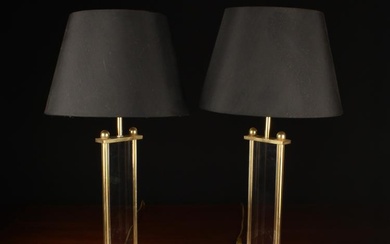A Pair of Lucite & Brass Side Lamps. The black...