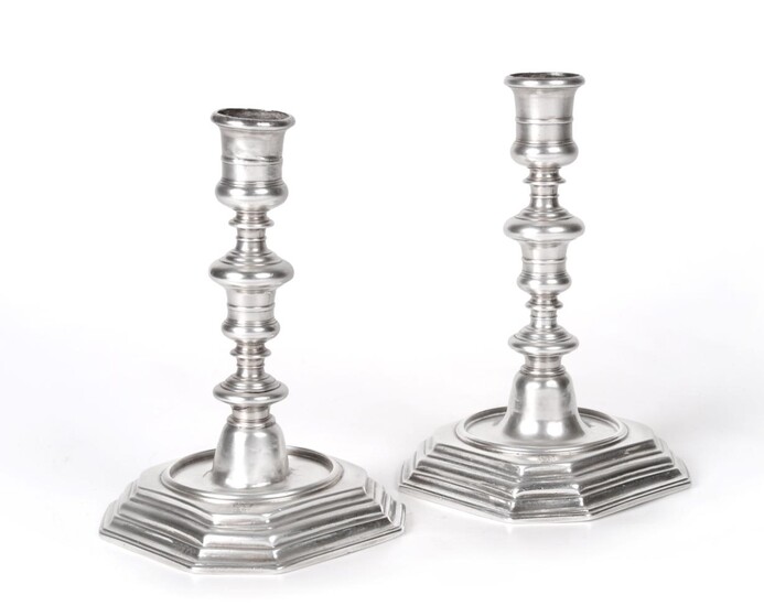 A Pair of Queen Anne Silver Candlesticks, by William Denny, London, 1702, each on stepped...