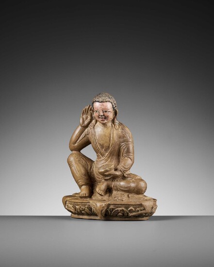 A RARE CARVED AND PAINTED LIMESTONE FIGURE OF MILAREPA, 15TH-16TH CENTURY 十五至十六世紀罕見彩繪石灰岩雕密勒日巴坐像