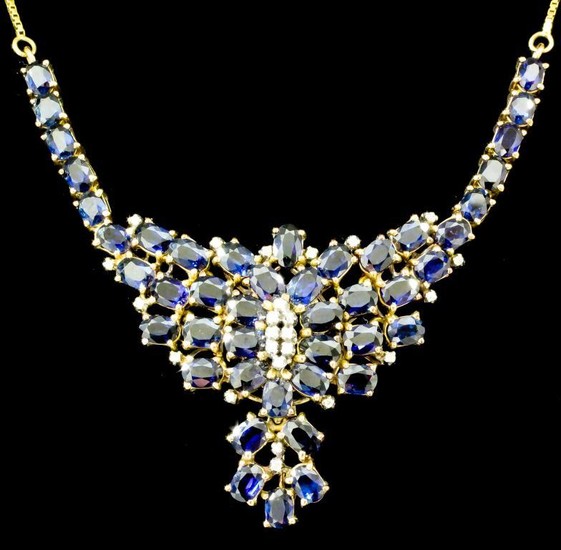 A Sapphire and Diamond Pendant, Modern, in 14ct gold...