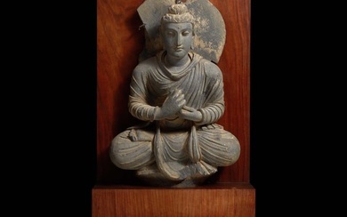 A carved schist figure of the seated Teaching Buddha, Ancient region of Gandhara, 2nd-3rd century