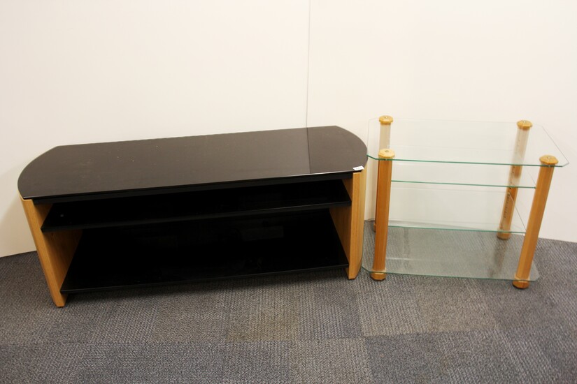 A contemporary black glass and wood tv stand, W. 135cm H. 51cm, together with a further wood and plate glass side table.