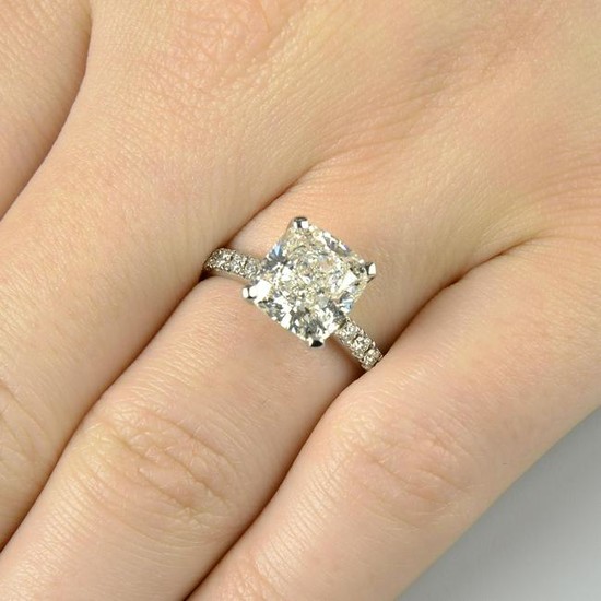 A cushion-shape diamond single-stone ring, with