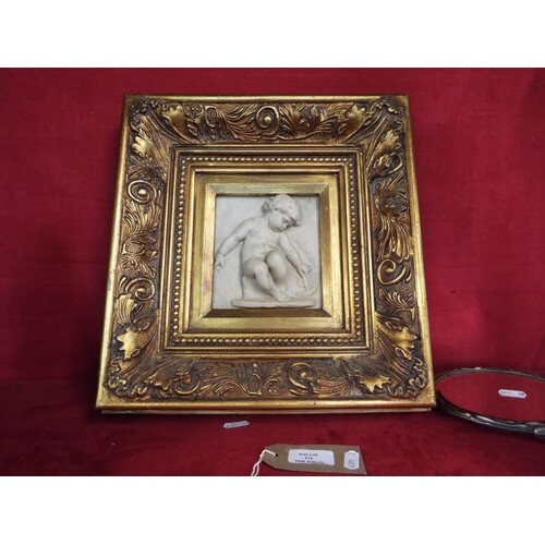 A gilt framed Russian marble plaque depicting putti and sail...