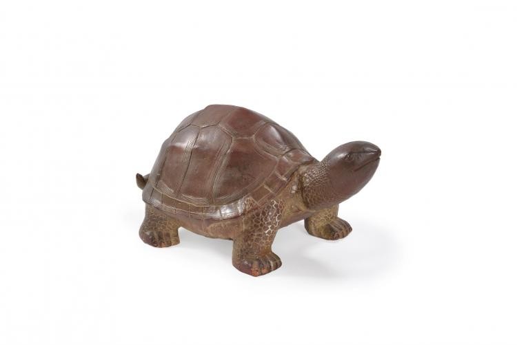 A glazed pottery tortoise sculpture