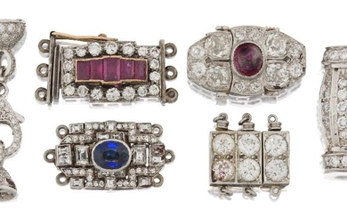 A group of six Art Deco diamond and gem clasps, comprising: an old-brilliant-cut diamond nine stone clasp, signed BB&B for Baily Banks & Biddle, numbered 31570; a platinum, cabochon ruby and old-brilliant-cut diamond oval clasp; a collet-set oval...
