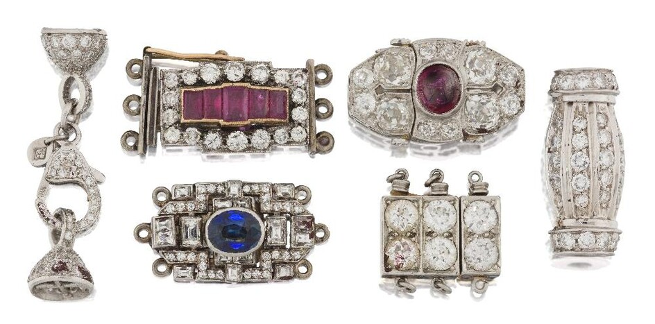 A group of six Art Deco diamond and gem clasps, comprising: an old-brilliant-cut diamond nine stone clasp, signed BB&B for Baily Banks & Biddle, numbered 31570; a platinum, cabochon ruby and old-brilliant-cut diamond oval clasp; a collet-set oval...