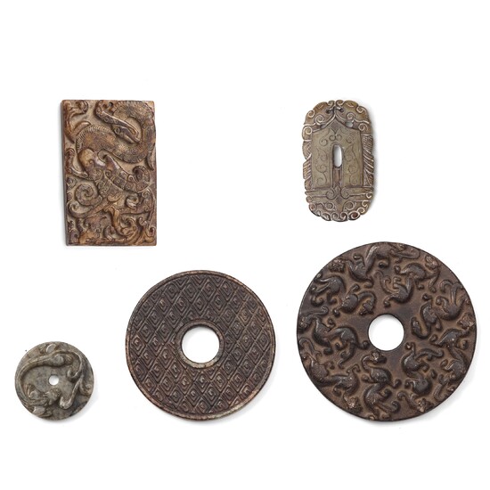 A group of three archaistic Chinese stone bi discs and two pendants.