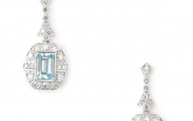 A pair of 14 karat white gold topaz and diamond earrings. Featuring fourty four single cut diamonds of ca. 0.58 ct. and a light blue step cut topaz of ca. 0.60 ct. each. Gross weight: 4 g.
