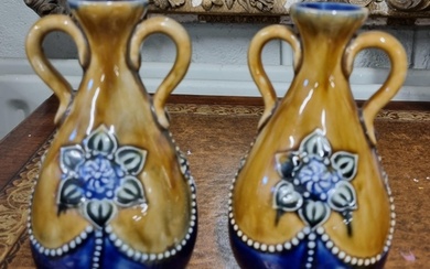 A pair of 19th Century Royal Doulton salt glaze Ewers along ...