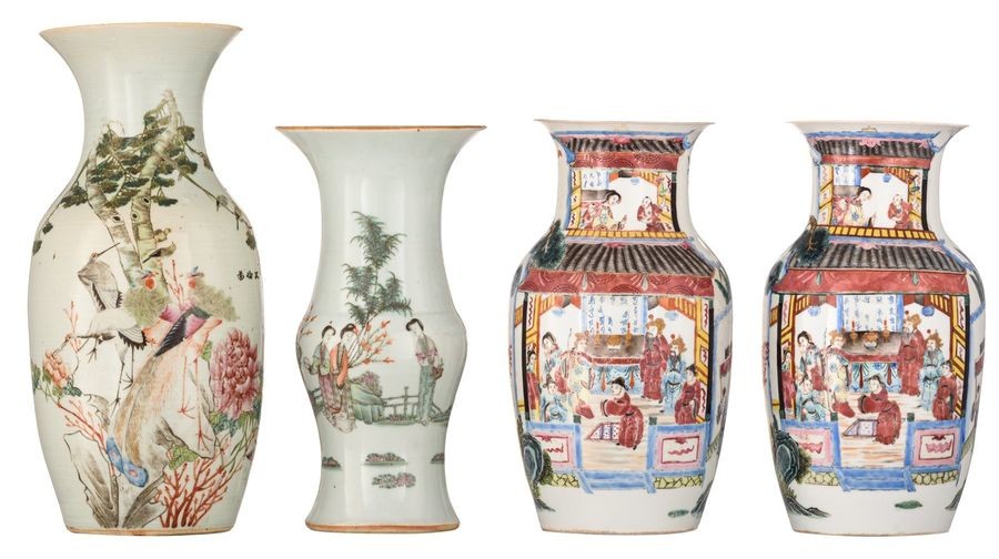 A pair of Chinese famille rose vases, decorated...