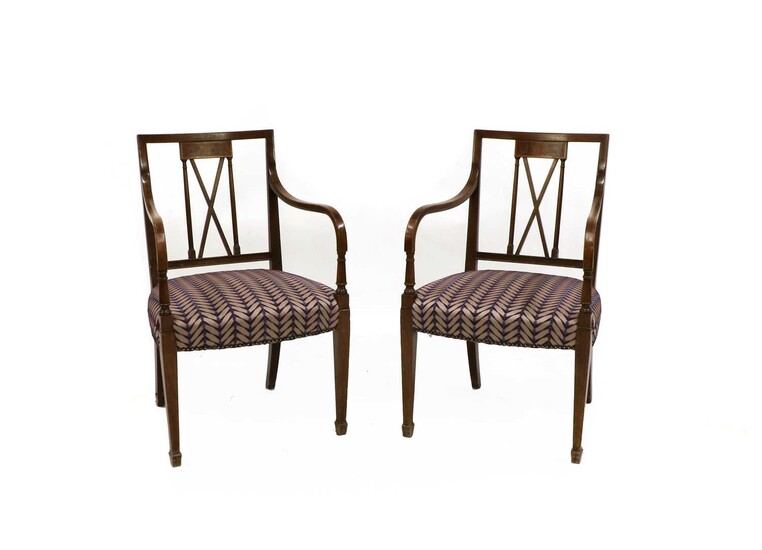 A pair of Sheraton style mahogany elbow dining chairs