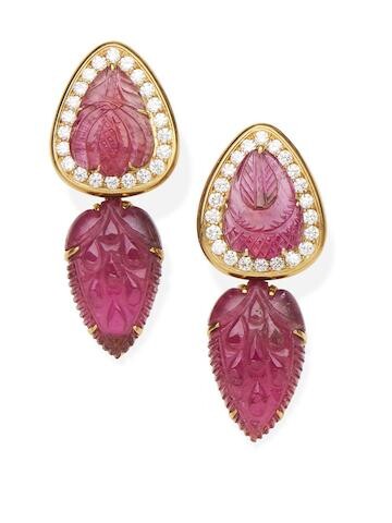 A pair of carved tourmaline and diamond pendent earrings with carved tourmaline drops