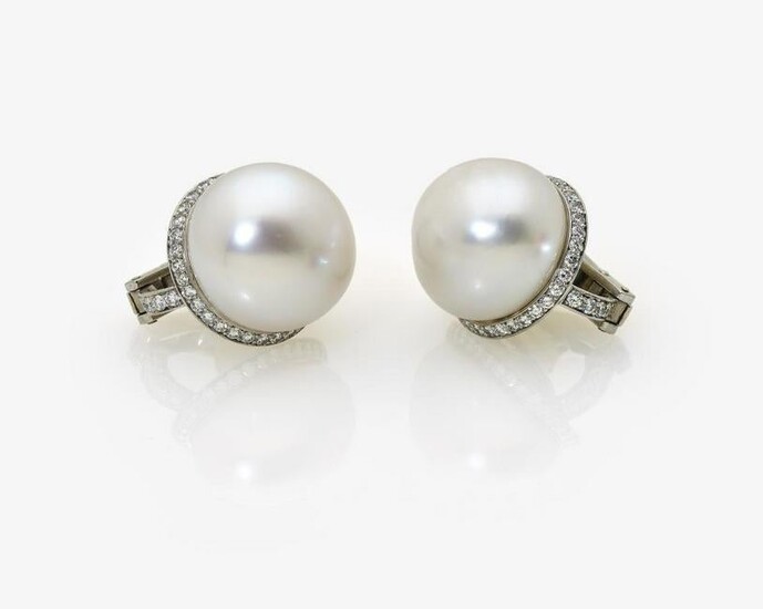 A pair of ear clips with South Sea cultured pearls and