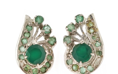 A pair of emerald ear studs each set with numerous circular-cut Colombian emerlads, mounted in sterling silver. (2)