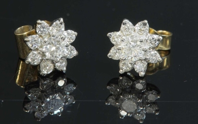 A pair of gold diamond set flowerhead cluster earrings