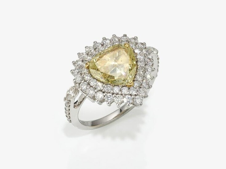 A ring with a yellow brilliant cut diamond and diamonds
