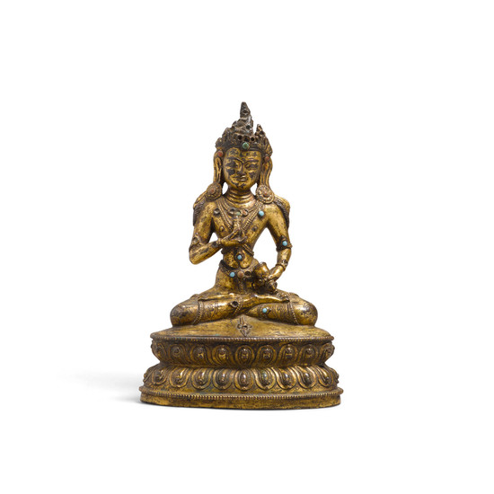 A seated gilt metal alloy figure of Vajrasattva