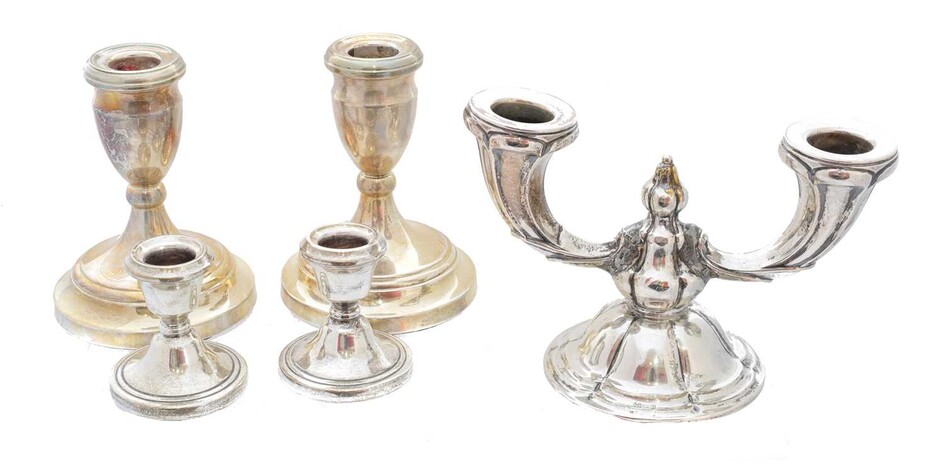 A selection of silver candlesticks