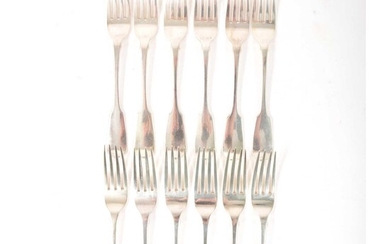 A set of twelve George IV silver table forks