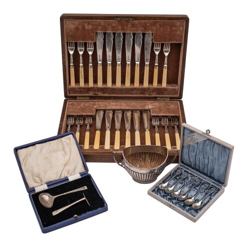 A set of twelve silver fish knives and twelve matching forks...