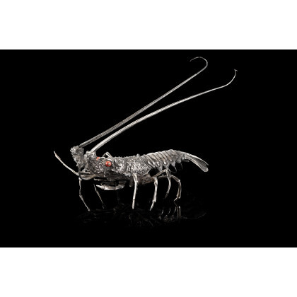 A silver sculpture representing a lobster with coral eyes. Titled 800, Buccellati silversmith (cm 21) (g 650) This lot...