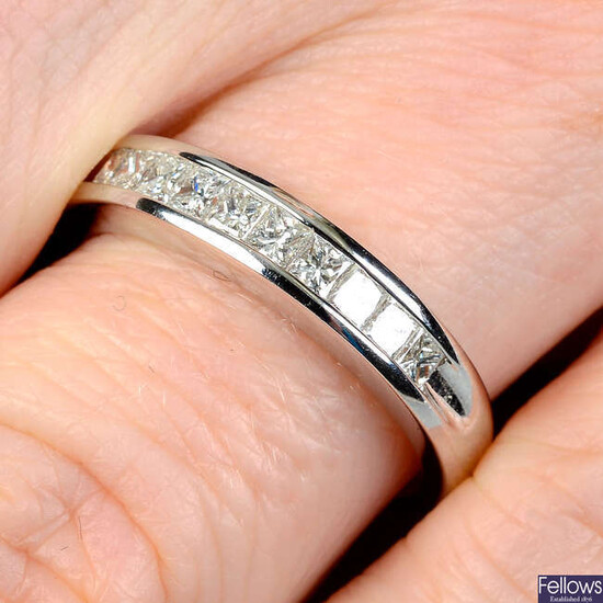 A square-shape diamond half-eternity ring.