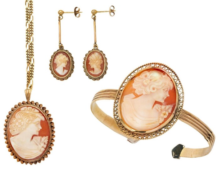 A suite of shell cameo jewellery comprising: a bangle, British import marks for 9-carat gold; a brooch/pendant and chain, British import marks for 9-carat gold, and a pair of earrings, British hallmarks for 9-carat gold, each set with an oval shell...