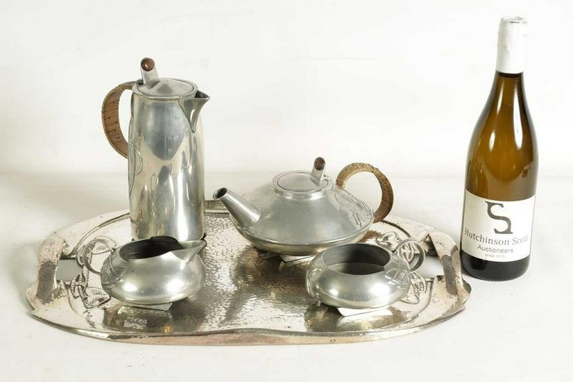 AN EARLY 20TH CENTURY ARCHIBALD KNOX FOR LIBERTY AND CO. TUDRIC PEWTER TEA SET