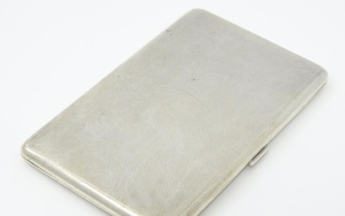 An Art Deco silver cigarette case with three sectional inter...
