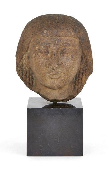 An Egyptian-style quartzite head, with curled hair, fringe, on square mount, Not ancient, 11.5cm. high