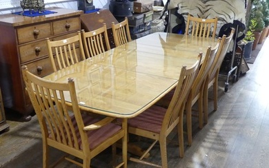 An Ercol windsor extending Dining Table together with eight ...