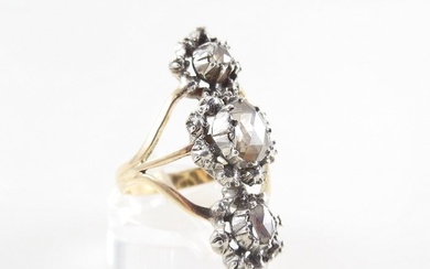 An antique ring reminiscent of a princess ring. The gold...