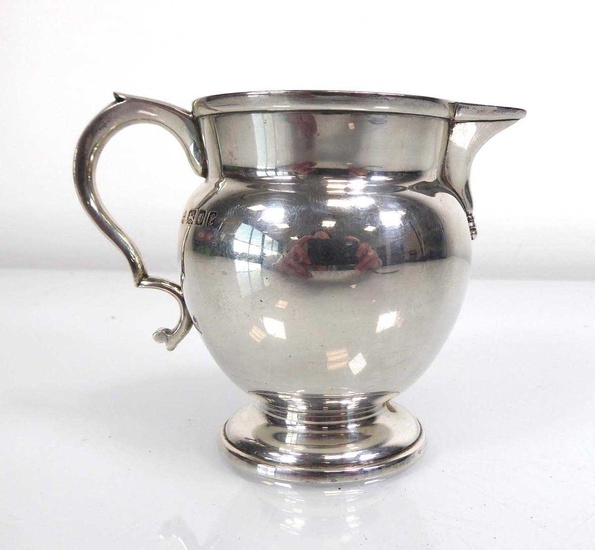 An early 20th century silver cream jug, maker W&W, London...