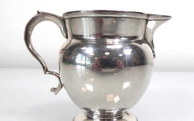 An early 20th century silver cream jug, maker W&W, London...