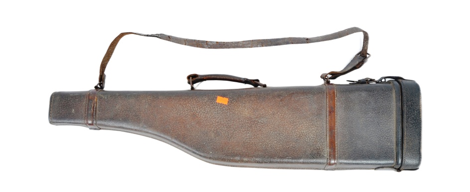 An early 20th century stitched brown leather leg of mutton shotgun case having a leather shoulder strap and brass lock. Original labels to the top. Measures approx. 77cm x 21cm.