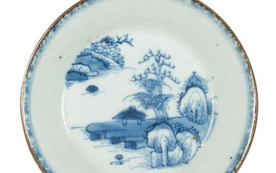 An saucer dish in blue and white porcelain depicting a