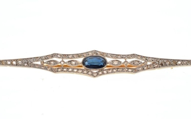 Barrette brooch in 18 K (750 °/°°°) yellow and white gold decorated with rose-cut diamonds and an oval sapphire in the centre