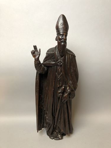 Bishop in carved and patinated natural wood. H....