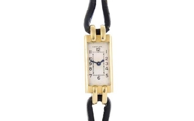 CARTIER - a wrist watch. Yellow metal case. Numbered