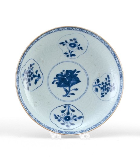 CHINESE BLUE AND WHITE PORCELAIN PLATE With floral cartouches on a carved cloud ground. Diameter 8.5".