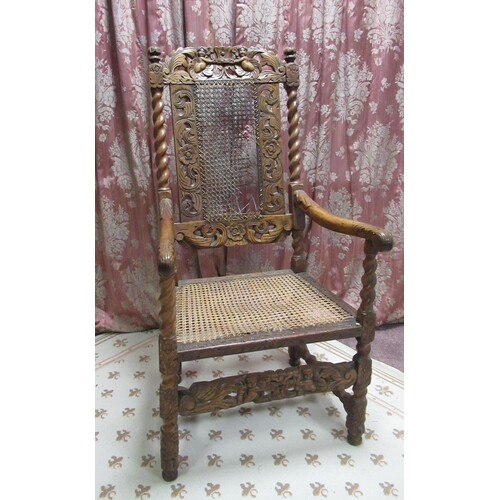 Carolean style walnut elbow chair, with cane work seat, back...