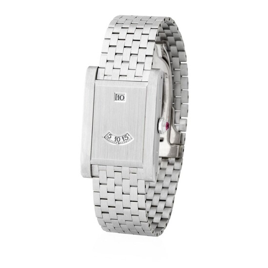 Cartier. Very Elegant and Charming Tank à Guichet in Platinum With Unusual Jumping Hour Complication, Bracelet, Box and Papers