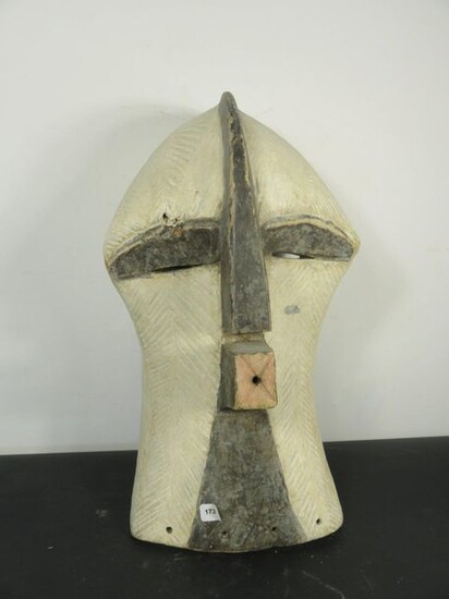 Cubist" style MASK Heavy wood. Small lacks and splinters, cracks and a worn out hole. Mouth, ears and crest extending with the nose. Zaire, Songye. In the family for 50 years. Height 47 cm
