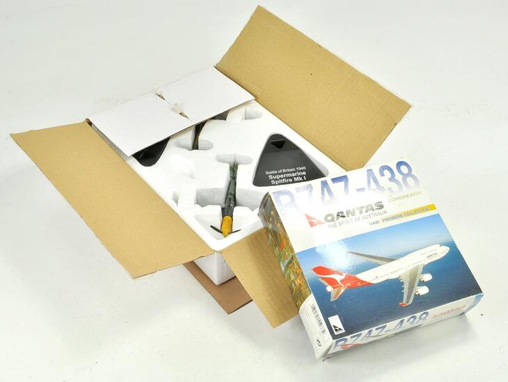 Duo of diecast model aircraft with boxes.