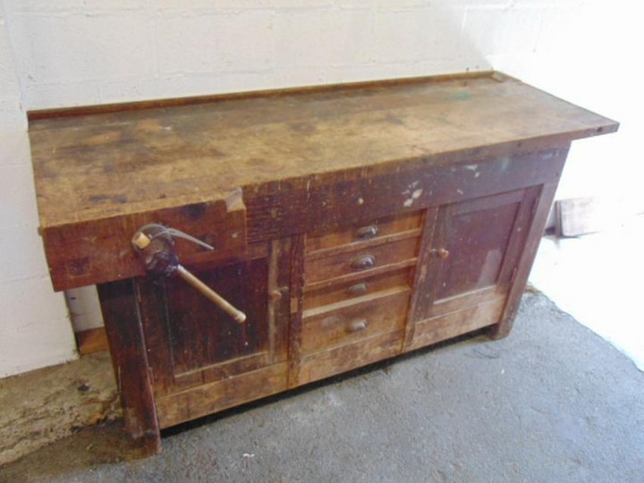 Early work bench,4 drawer center flanked by doors, one