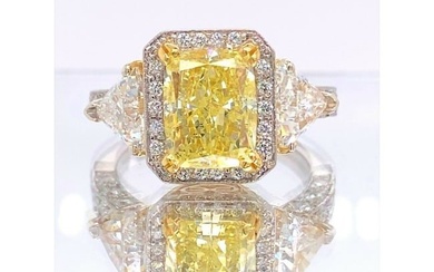 Fancy Yellow Cushion Diamond 4.91 Tcw Three Stone Engagement Ring 18kt WG YG