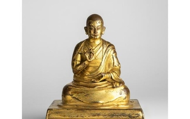 GILT BRONZE SEATED FIGURE OF A LAMA QING DYNASTY, 17TH